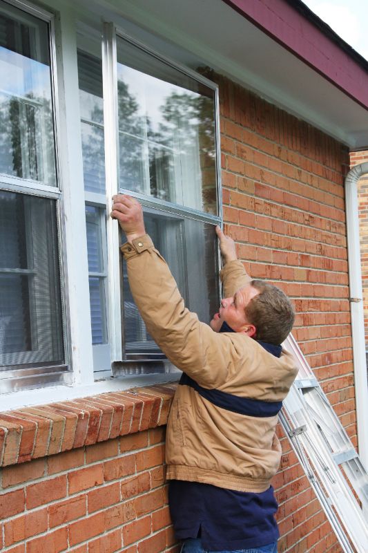 Storm Window Installation on a Home